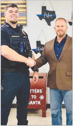 Officer Grant Hensarling is welcomed back to the Silsbee Police Department by Police Chief Shawn Blackwell.Hensarling has six and a half years of experience in law enforcement, including working with the Tyler County Sheriff’s Office, Silsbee Police Department and most recently with the Woodville Police Department. Courtesy photo