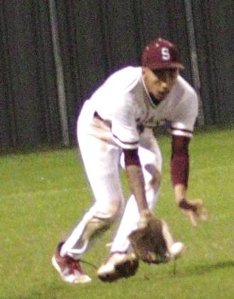 Silsbee left fielder scoops up a hard hit ground ball to left during the Tigers 4-3 loss to Bridge City on Tuesday. He fired the ball back into the infield and held the batter to a single. Danny Reneau photo
