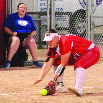 Kountze Lady Lion Emily Smith picks up a ground ball and beats a path to first base to get a Buna batter out.The Lady Lions have a record of 24-4 this season and are headed for the playoffs. Danny Reneau photo