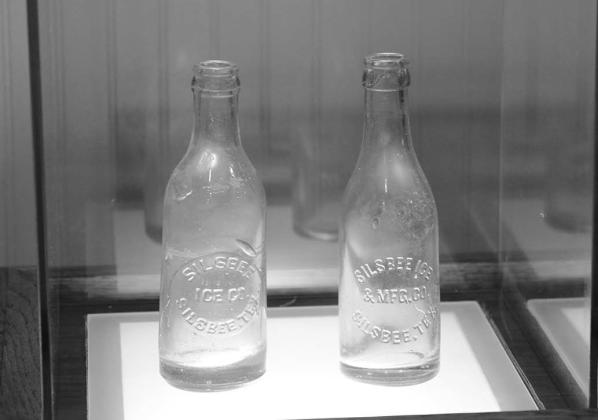 PHOTO BY CHRIS MECHE, THE BEE Bottles bearing the imprint of the Silsbee Ice and Manufacturing Company on exhibit at the Ice House Museum.
