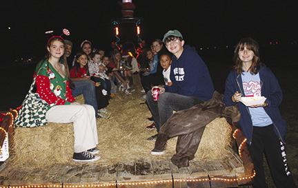 Although there was a light rain, several hundred people came to Lumberton City Park last Friday night to celebrate the beginning of the Christmas season.The event under the pavilion included a flag ceremony by Troop 181, singing of Christmas songs by primary school students, the lighting of the large Christmas tree, hayrides and train rides outside the pavilion, numerous other activities and the enjoyment of a large variety of foods by vendors at the park.