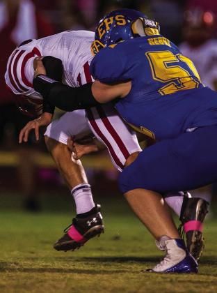 Casey Lewis on the tackle against Deweyville.