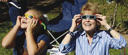 People of all ages put on special solar eclipse viewing glasses to watch the special event in the sky shortly before noon Saturday.A large crowd of people came to the Big Thicket Visitor’s Center to celebrate the 49th anniversary of the Big Thicket Preserve and to watch the eclipse. Dan Eakin photo