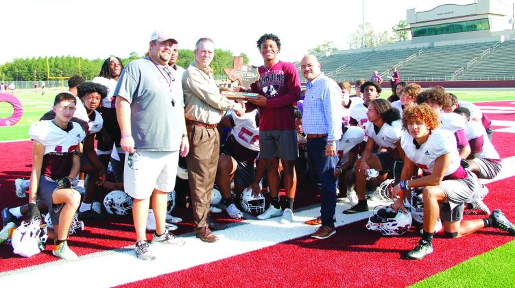 Silsbee Ford would like to congratulate Dre’Lon Miller for being selected to receive the “Built Ford Tough” Player of the Week in 4A-D2 Week #5 against West Orange Stark. Presenting the award on behalf on Silsbee Ford is Robbie Biddy and Charlie Montgomery. Photo by Amy Gonzales, The Bee.