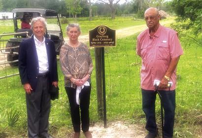 Speakers for the ceremony in which the Grayburg Black Cemetery marker was unveiled are, from left, James A. McKim III, Julie McDaniel and Rev. Clarence Russell.