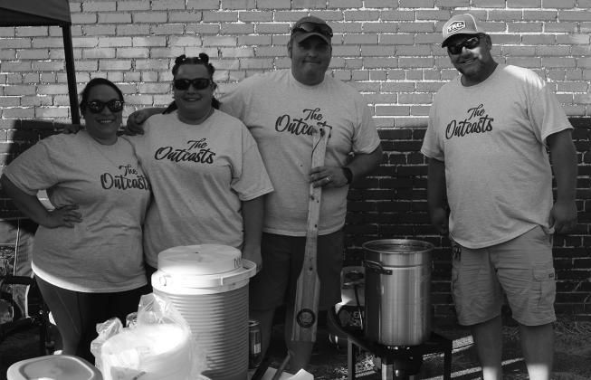 The Outcast Gumbo Cook-off team including former Bee employee, Sarah Gordon. hand-crafted items such as cups. Also, Buna High School’s automotive class was there to promote a raffle. They are raffling off hunting items to raise funds for their program. Photos by Chris Meche, The Bee.
