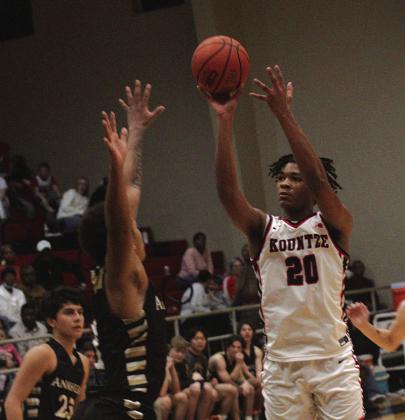 Jermaine Warren (20) takes a short jump shot against Anahuac on Friday. He had a minor injury over Christmas break but he has recovered and is now giving the Lions a bigger player. Photo by Danny Reneau