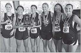 Silsbee Varsity Girls Cross Country team with their District Champions trophy. Photo courtesy of Silsbee ISD.