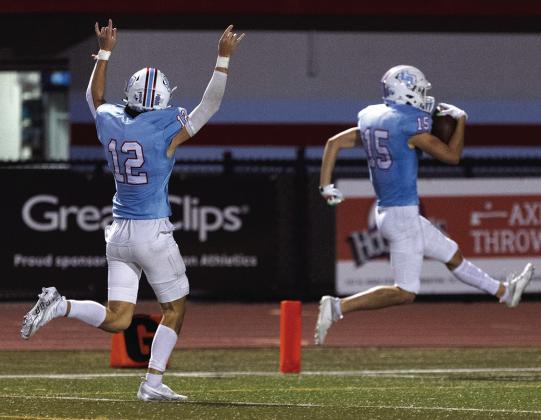 Broc Bonner celebrating as Brady Fuselier takes it into the end zone. Photos by Brent Guidry.