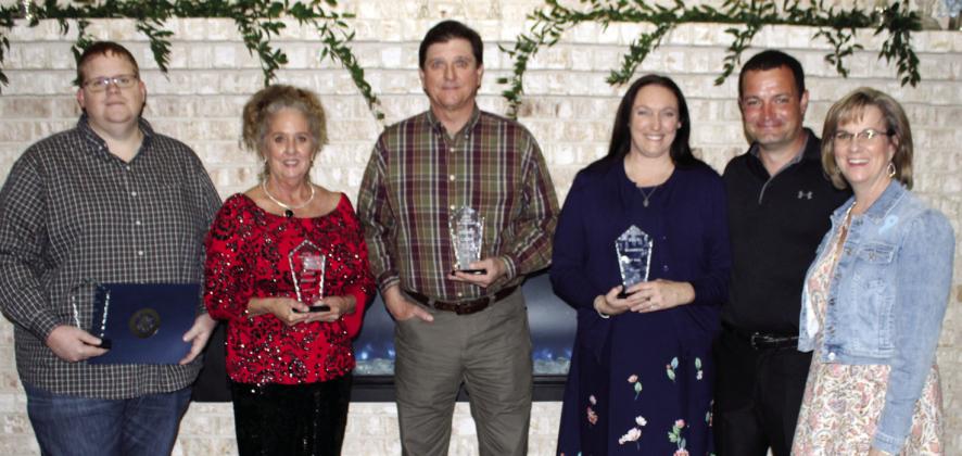 The Kountze Chamber of Commerce presented five awards at the annual banquet last Thursday night. From left are Jason McDonald, Kountze school board member who accepted the Teacher of theYear award for Karen Keys; Connie Winger, winner of the President’s Choice Award; Stuart Laird, Citizen of the Year; and Charles and Pamela Edmonds, owners of Isidore Farms, winner of the Business of the Year award. At right is Donya McLaurin, Kountze chamber president. Dan Eakin photo
