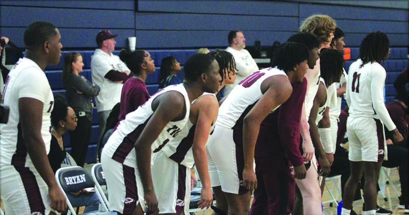 Members of the Silsbee Tigers basketball team watch intently as their fellow teammates battle the Booker T. Washington Eagles last Saturday at Bryan High School.The Tigers played their hearts out but lost 76-70 in the regional final. Photo by Danny Reneau