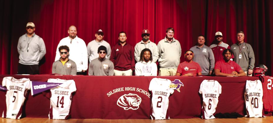 The Silsbee High School football players signing letters of intent include: (front row left to right) Mason Brisbane at University of Mary Hardin Baylor, Max Brisbane at the university of Mary Hardin Baylor, Kevin Martin at Hardin Simmons University, Jerrick Harper at Trinity Valley Junior College and Jayron Williams at Lamar University. The coaches (standing left to right) Trent Jones,Randy Smith,Keaton Baker,Radi Verrett, Michael Nelson, Cole Burrus, Corey Harrison, Jarrod Morris and Ronald Loftin.