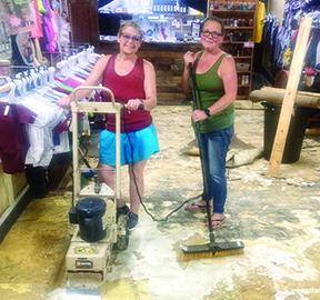 Doodle Bug Designs in downtown Silsbee was damaged by flooding on Monday of last week and again on Thursday. The store was closed as Beth Sterling and Ashlea Crook worked to clean up the floor which was damaged by the flooding. Dan Eakin Photo