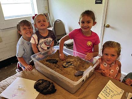 Children at the Kountze Public Library have fun looking for tracks in the sand. PHOTOS COURTESY OF MARY CATHERINE JOHNSTON