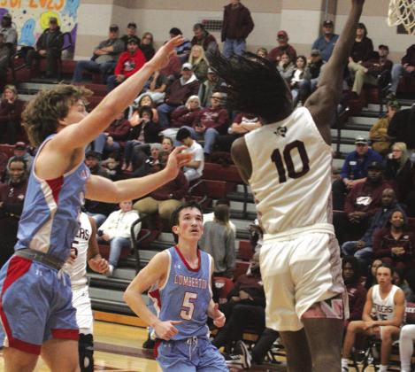Geremiah Jackson lays the ball off the glass as two Raiders wait to grab a rebound.The undersized Raider team that lost their big man Aidan Millican to an injury a couple of weeks ago played valiantly against the highly regarded Tiger team.