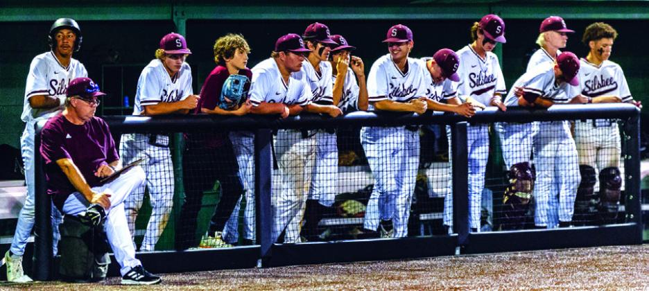 Members of the Silsbee High School baseball club line the fence behind Assistant Coach Ron Luna. The group includes: (left to right) Jaden Johnson, Taylor Wise, Cody Johnson, Landon Gibson, Aiven Paine, Matthew Ard, Grayson King, Jackson Perdue, Parker Martin, Joden Baaker and Jaylyn Fobbs. Photo by Brent Guidry