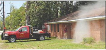 Smoke came pouring out of a window and other parts of the house as Silsbee firefighters arrived at 500 Roosevelt Drive Monday morning. An oven was said to have been self cleaning when fire began to spread in the kitchen. Several fire trucks arrived promptly at the scene. Photo by Dan Eakin