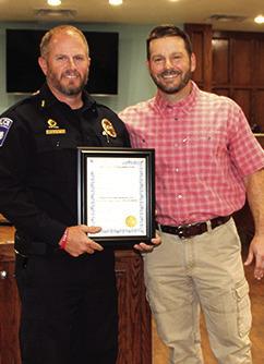 Silsbee Police Chief Shawn Blackwell, left, is presented a proclamation from Silsbee Mayor Kevin Garner proclaiming May 15 as Peace Officer Memorial Day and the week of May 15 each year is to be Police Week.