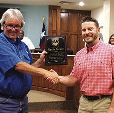Silsbee Mayor Pro Tem Mark Muckleroy presents Mayor Kevin Garner with an Appreciation Plaque for having served as mayor of the city. The plaque was presented Tuesday night,which was the last night Garner was to moderate a city council meeting.