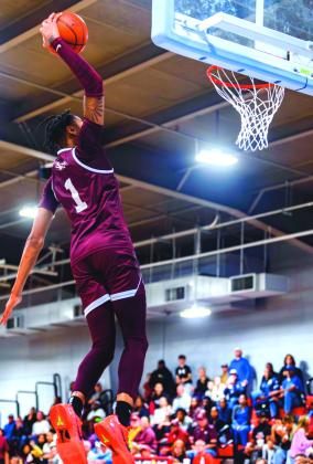 Silsbee Tiger Jarred Harris (No. 1) dunks the ball in the game against the Lumberton Raiders last Friday night. Brent Guidry photo