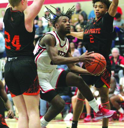 Zac Sells drives the lane against LaPorte during the championship game of the Hardin-Jefferson tournament. Sells is a two time District MVP of the AAA district. Danny Reneau photo
