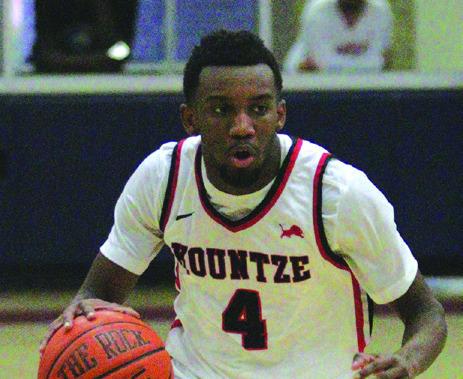 Kountze Lion Mason Donald heads down court in a recent game. The Lions upped their season record to 12-3 in the Hardin-Jefferson Tournament. Danny Reneau photo