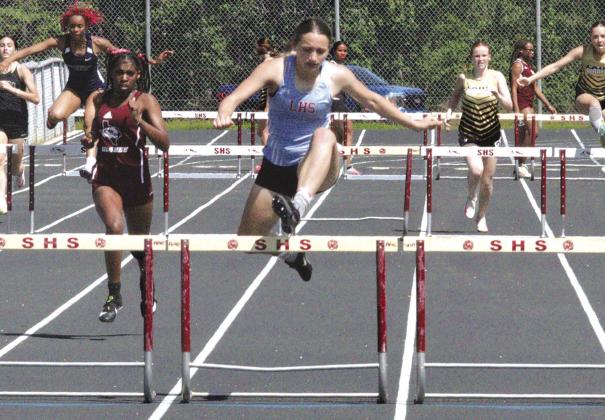 Brenly Alford runs in the prelims of the high hurdle event.The Lumberton freshman placed second in the high hurdle event and won first in the 300 meter hurdle event. Danny Reneau photo