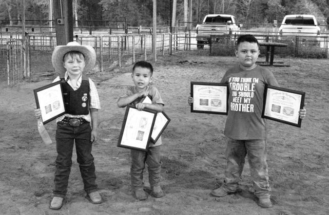 Beaux Marbel, Carson Martinez and Hudson Martinez receiveing their certificates. Buckles will be recieved at a later date. PHOTO COURTESY OF JENNIFER LANGSTON
