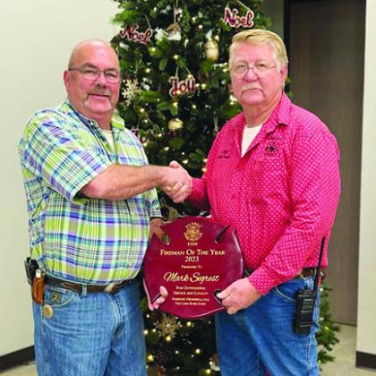 Mark Segrest, left, is presented Silsbee Fire and Rescue’s 2023 Fireman of the Year Award by Silsbee Fire Chief Robin Jones. Courtesy Photo