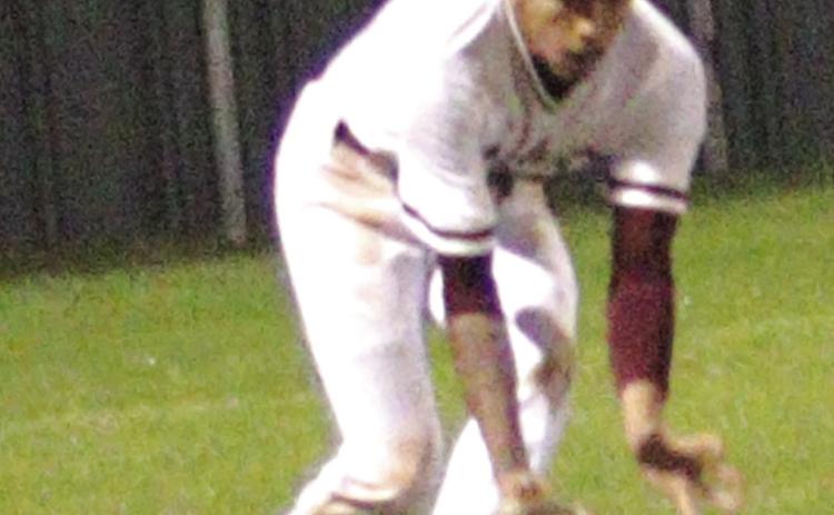 Silsbee left fielder scoops up a hard hit ground ball to left during the Tigers 4-3 loss to Bridge City on Tuesday. He fired the ball back into the infield and held the batter to a single. Danny Reneau photo