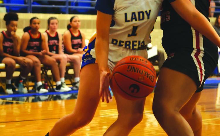 Mallory Dougharty dribbles past a defender in a recent game in Evadale.The Lady Rebs are off to an 8-1 start this season. Photo by Melissa Riedinger