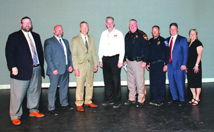 Speakers for the Town Hall meeting Monday night at the Silsbee High School auditorium were, from left, Jonathan Lee, United States District Attorney, Eastern Division, Beaumont; Jason Wheeler, special DEA agent; U.S.Rep.Brian Babin; Kim Bartel of Region 5 Prevention Resource Center; Hardin County Sheriff Mark Davis; Silsbee Police Chief Shawn Blackwell; Dr.Gregg Weiss,Silsbee ISD superintendent; and Kirsten Martin, Silsbee ISD director of health services.