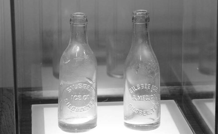 PHOTO BY CHRIS MECHE, THE BEE Bottles bearing the imprint of the Silsbee Ice and Manufacturing Company on exhibit at the Ice House Museum.