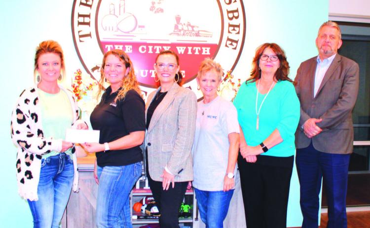 The Silsbee Chamber of Commerce and Silsbee Economic Development Committee presented Stacey Cossman with a $1000 check for participating in Shop Small Saturday drawing Saturday, November 25. Tickets were given out by Silsbee businesses during time of purchase allowing the chance to win.