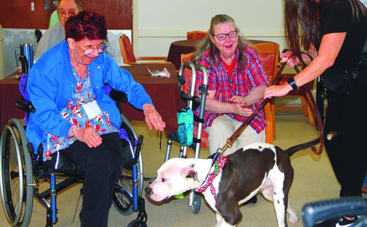 Residents from Paradigm at Kountze Nursing Home were were visited Friday, December 8 with rescue pets from Anna’s Angels Rescue. The animals came dressed up in holiday attire and were ready to play. Amy Gonzales photo