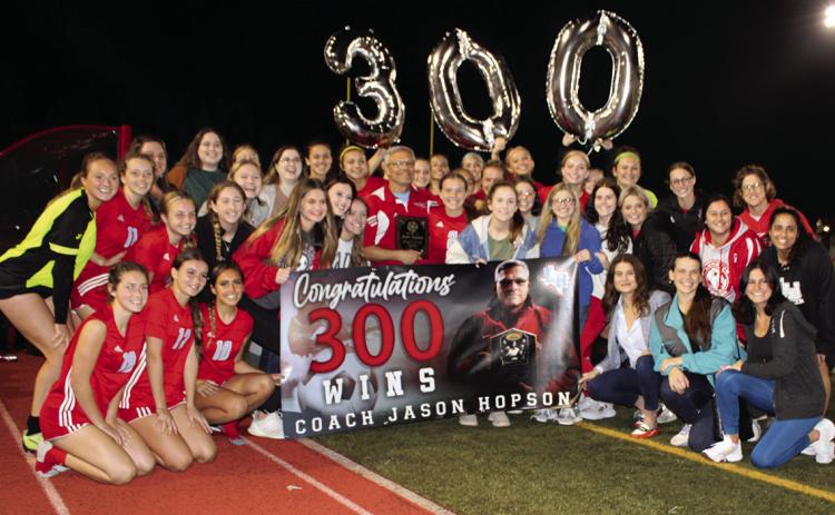 The 300th win of Jason Hopson, Lumberton High School girls soccer coach, was celebrated in a big way following their 7-0 win over the Bridge City Lady Cardinals on Tuesday night, Feb. 7, in Lumberton.The beloved coach was presented with the banner, shown in front, with a cake, following a video shown on the big screen at the football field.