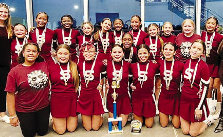 Silsbee ISD cheerleaders took to the mat on November 5 at the UCA Houston regional competitions. The Silsbee Middle School cheerleaders, shown above, won first place in the Small Junior High Traditional Routine and second place in the Small Junior High Game Day Routine. The Silsbee High School cheerleaders placed second in the DII Super Varsity Game Day Division. Courtesy Photo