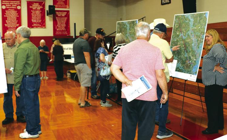Various maps, drawings and other information was placed on walls or laid on tables at the TxDOT meeting on Tuesday night,April 2, at the Kountze High School gym.TxDOT employees were also on hand to answer questions. Danny Reneau photo