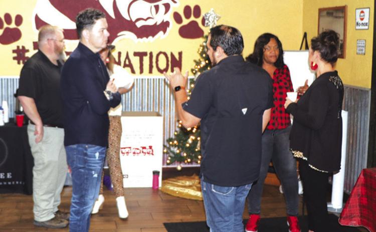 Members of the Silsbee Chamber board of Directors including Nathan White, Patrick Nichols, Briget Gilder, Christy Brown and Ambassador Ricky Jimenez were present to wait tables and serve pancakes during the Chamber Christmas Pancake Breakfast. Courtesy Photo