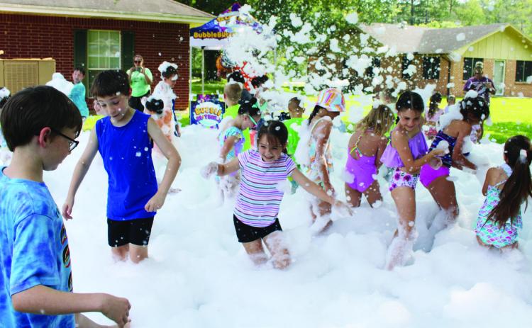 Kids of all ages came to the Lumberton Public Library’s Summer Reading Kickoff Party last Saturday to have fun in the foam and bubbles offered by Bubble Blitzer of Silsbee,and to sign up for the Summer Reading Program. Dan Eakin Photo