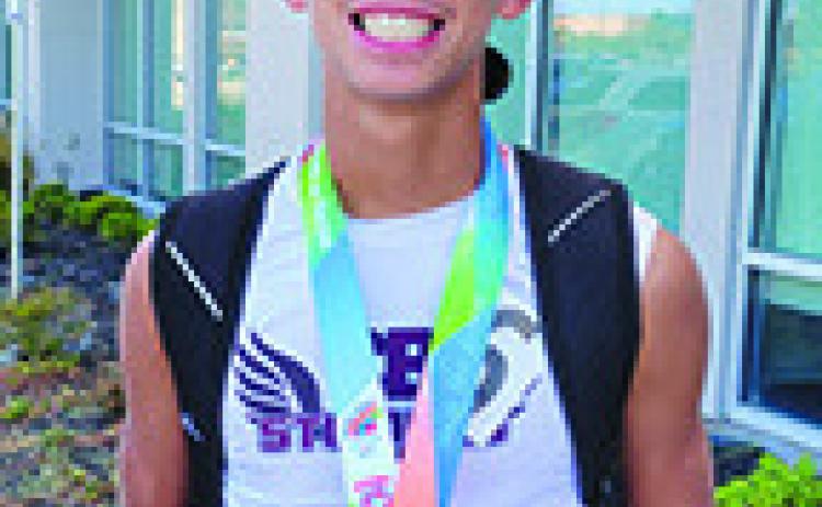 London Jessie qualifies for state with 800 meter dash school record