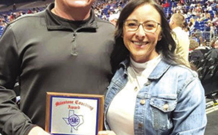 Robert Hollyfield was honored at the UIL State Girls Basketball tournament for his many years of coaching and winning over 600 games. He and is wife Debbie are both outstanding coaches who will be missed by fans throughout the area. Courtesy Photo