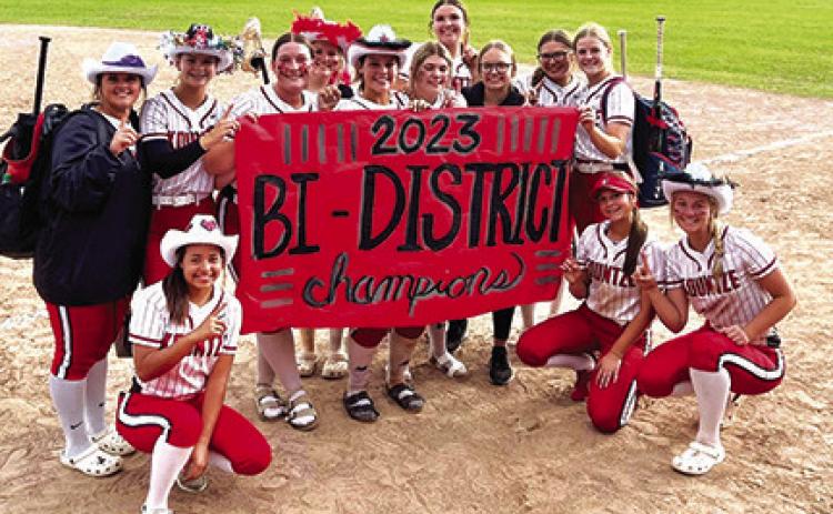 The Kountze Lady Lions proudly pose after winning the bi-district championship by defeating the Huntington Lady Red Devils in two of three games last weekend.They are, kneeling from left, Peighton Irvine, McKinley Rowinski and Kiley Kump; and standing from left, Tori Stutts, Laney Shivers, Emily Smith, Emma Wade, Kitty Coe, Shea Griffin, Cori Holyfield, Kaigen Parker, Kyla Parker and Kirstan Stanley. Not shown is MacKenzie Carlisle. Courtesy Photo